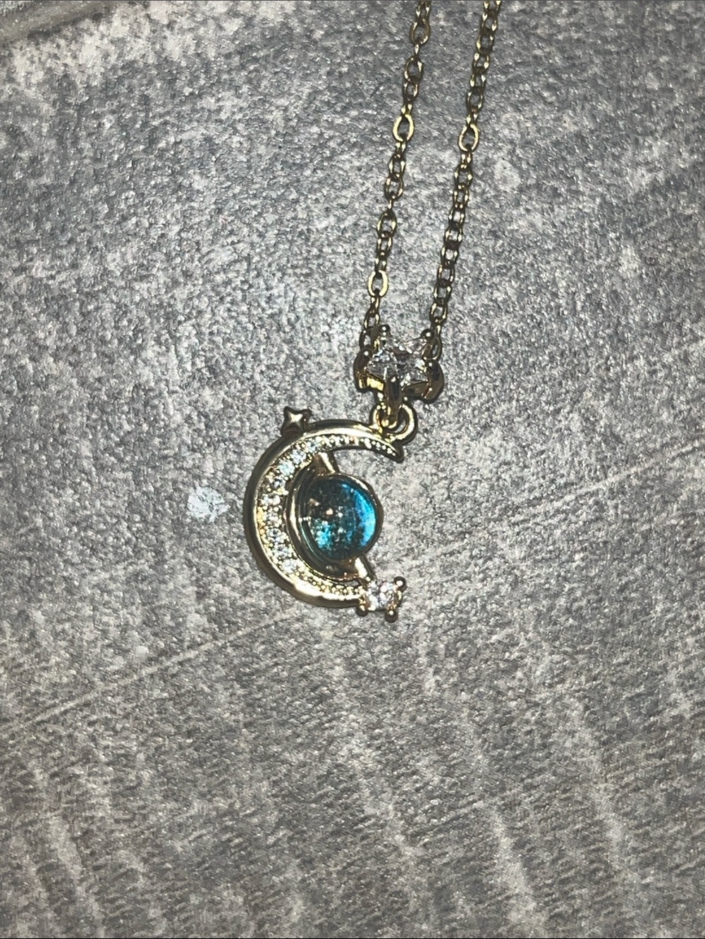 Gold Crescent Moon Necklace with Blue Gem Accent